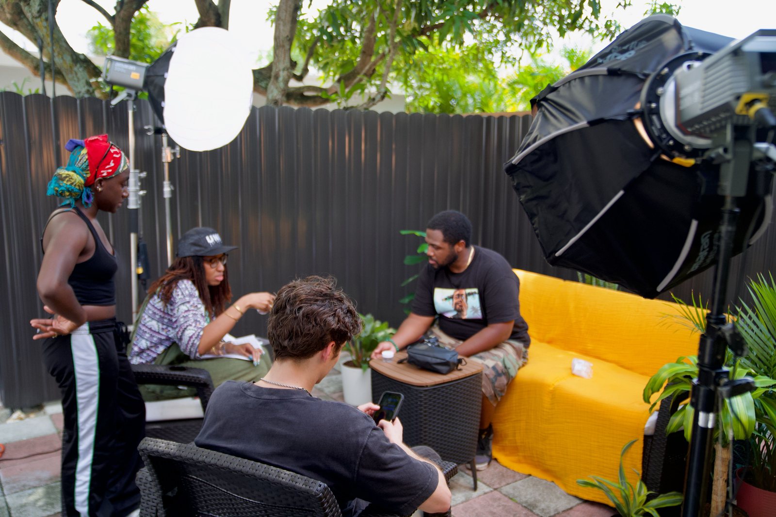 Katiana Farrier and crew on a lit outdoor set setup